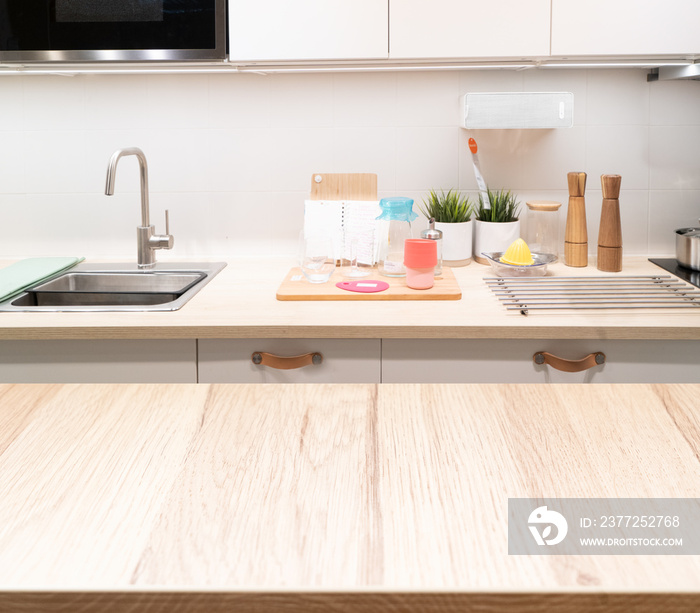 Wood table top on blur kitchen room