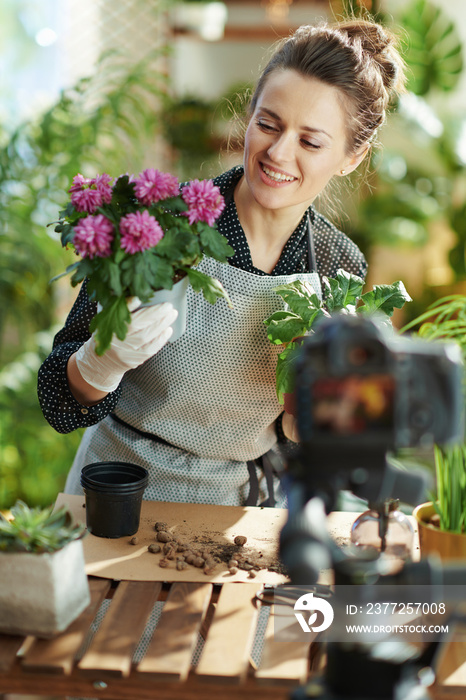 happy woman records gardening educational video tutorials