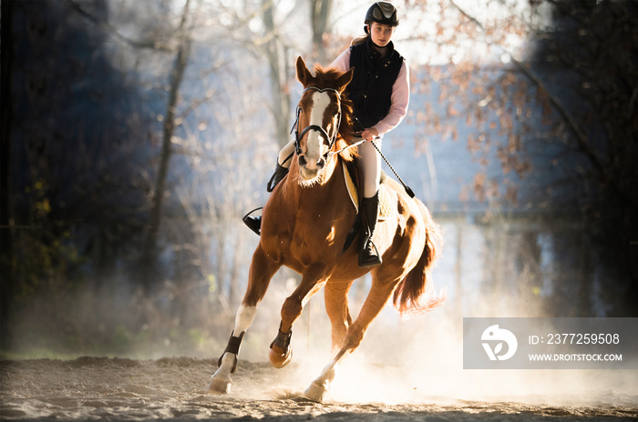 Young  girl riding a horse