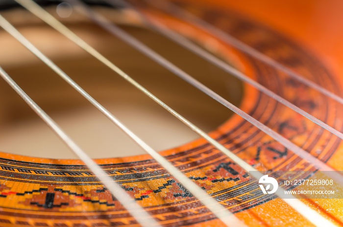 Detail of classic acoustic guitar with shallow DOF and blur