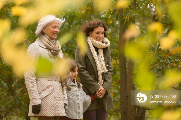 Multi-generation women walking in autumn park