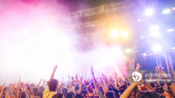 Young people dancing and having fun in summer festival party outdoor - Crowd celebrating fest concer