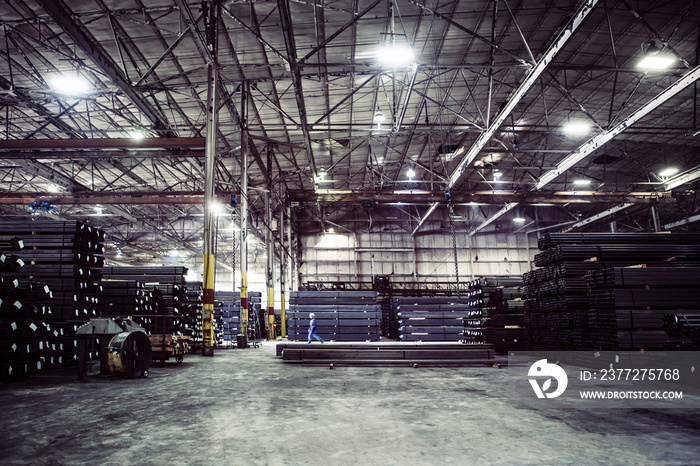 Girders stacked in warehouse