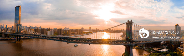 New York, New York, USA skyline with Brooklyn and Washington bridges near the Manhattan island.