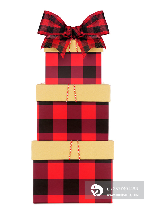 Stack of red and black buffalo plaid Christmas gift boxes with lid and bow. Side view isolated on a 