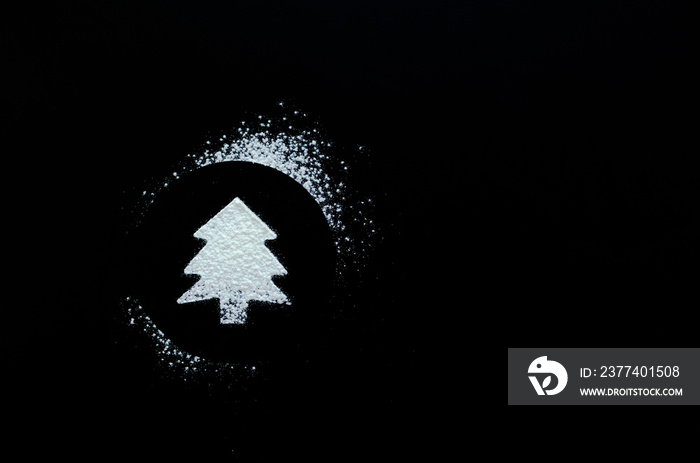 Christmas tree symbol on blackboard