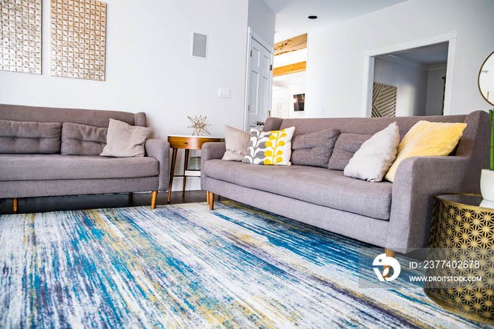 Mid century modern contemporary style living room den in a spacious open home with a vaulted ceiling