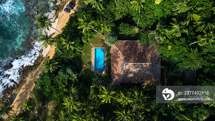 Aerial view of a villa with a swimming pool in the tropics. Hiriketiya beach, Sri Lanka