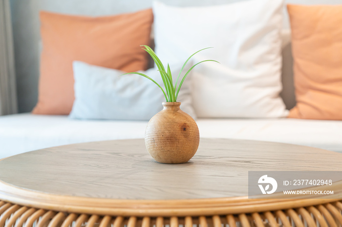 ceramic or porcelain vase with plant decoration on table in living room