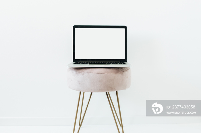 Minimal composition with blank screen laptop on white background. Stylish home office concept. Blog 