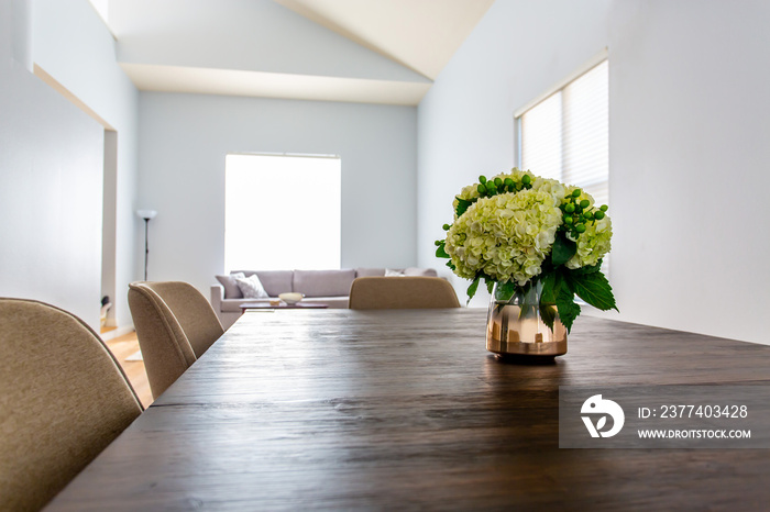 Bouquet On Wooden Dining Table Against Light Bright Walls