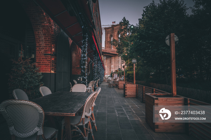 tables street walkway bridge brooklyn new york restaurant trees chairs sky