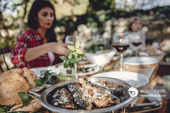 Served grilled fish at dining table