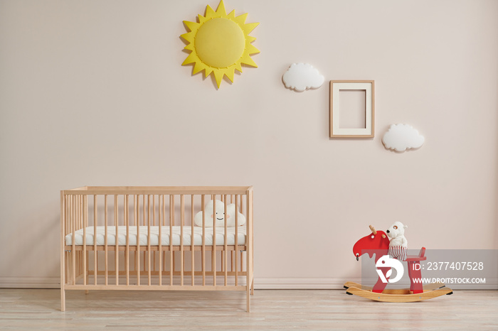 Wooden baby room furniture bed and crib, sun and cloud toys and frame style.