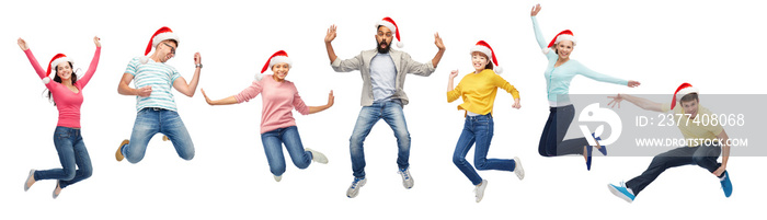 happy people in santa hats jumping in air