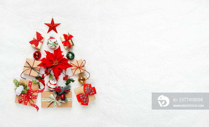 Christmas tree made from Christmas gifts and decorations on white background. Creative winter holida