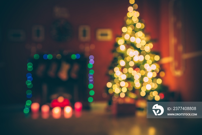 Beautiful  Defocused background new year room with decorated Christmas tree, gifts and fireplace wit