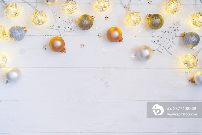 Christmas Holiday Balls and Christmas light balls on a white wooden background with copy space, flat