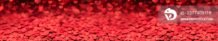 red background of small hearts, long panorama layout defocused