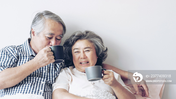 senior couple happy love Elderly couple smile face, old man and senior woman relaxing in bed room dr