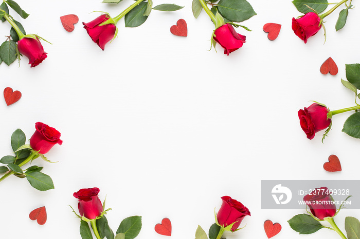 Flowers composition. Frame made of red rose on white background. Flat lay, top view, copy space.