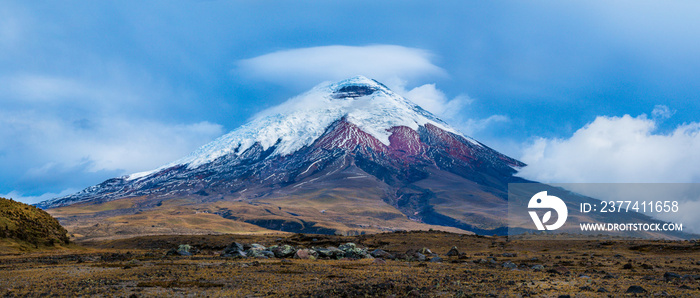 The Giant  Cotopaxi volcano with a lenticular cloud in Ecuador. High mountains landscape background.