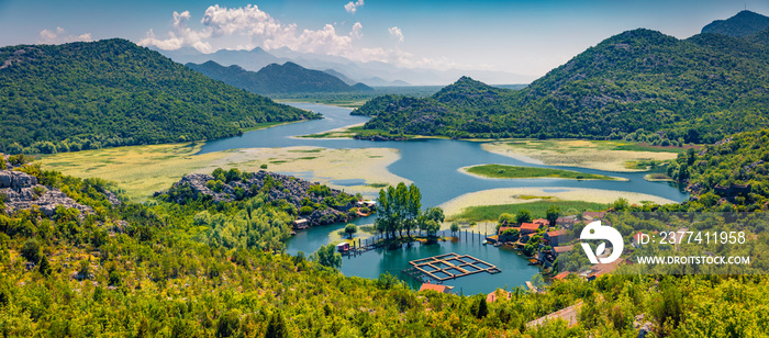 Panoramic view of  Rijeka Crnojevica river, Skadar lake location. Attractive summer scene of Karuc village, Montenegro, Europe. Beautiful world of Mediterranean countries.