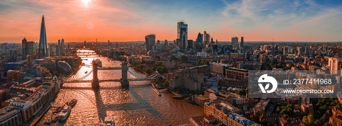 Arial view of London with the River Thames floating through the city near the Tower Bridge, London City and Westminster Abbey.