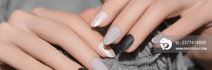 Female hands with gray nail design. Glitter black nail polish manicure. Advertising banner. Banner Ad.