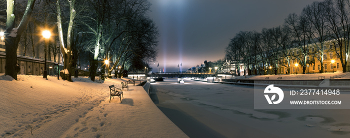 Turku by night. Urban landscape with frozen river.