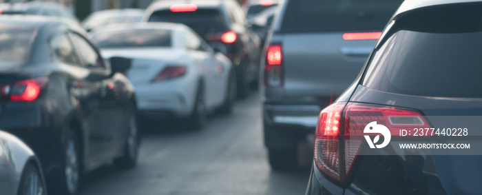 Rear tail lamp light of car shine in red on the road.