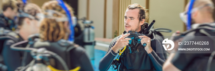 Diving instructor and students. Instructor teaches students to dive BANNER, long format