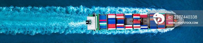 Aerial top view of container ship with contrail in the ocean sea ship carrying container and running for export from container international port to custom ocean concept freight shipping by ship