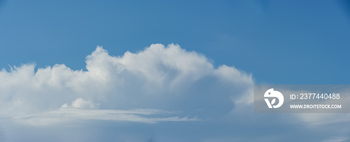 Cumulus and stratus clouds against the blue sky.