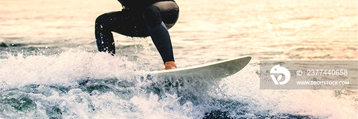 Dynamic water sports enthusiast shifts his focus on the wakeboard to keep the balance steadfastness fear water learning challenge