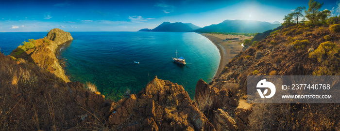 Panorama of Cirali beach and Olimpos mountain in a sunset