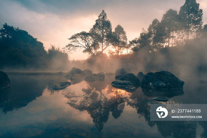 Beautiful sunrise at Chae Son Hot Springs over the misty morning is a famous place and destination at Lampang, Thailand.