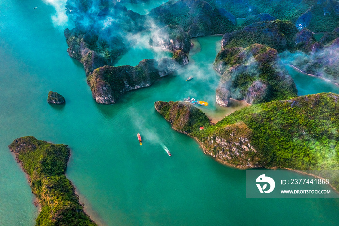 Aerial view of Sang cave and Kayaking area, Halong Bay, Vietnam, Southeast Asia. UNESCO World Heritage Site. Junk boat cruise to Ha Long Bay. Popular landmark, famous destination of Vietnam