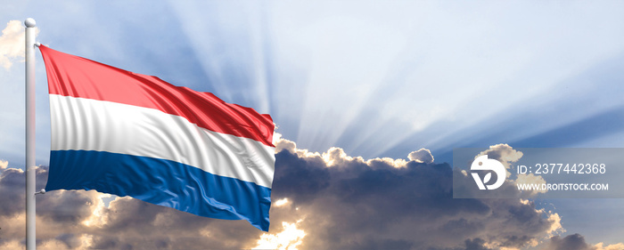 Netherlands flag on blue sky. 3d illustration