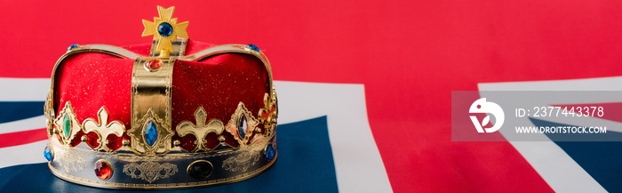 panoramic shot of golden crown on british flag