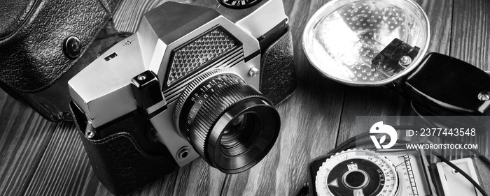 Old vintage photo camera, flash and exposure meter