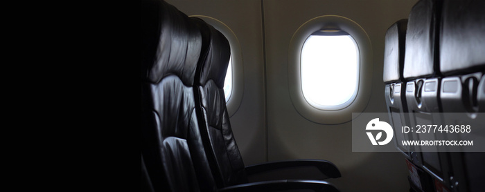 Empty passenger seat rows in plane panning shot airline business problem from panemic