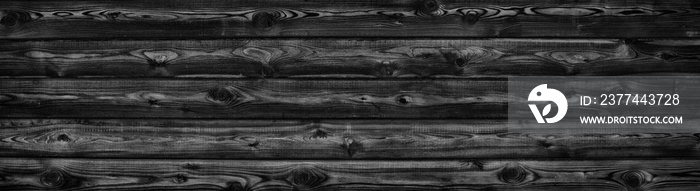 Black larch grain wood wide panoramic texture. Widescreen wooden plank pattern backdrop. Dark rural background