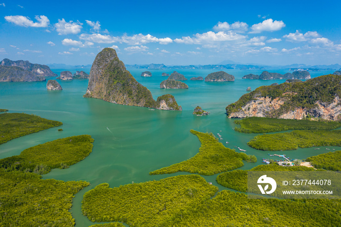 Aerial drone view of beautiful limestone islands surrounded by mangroves in a tropical bay (Phang Nga Bay, Thailand)