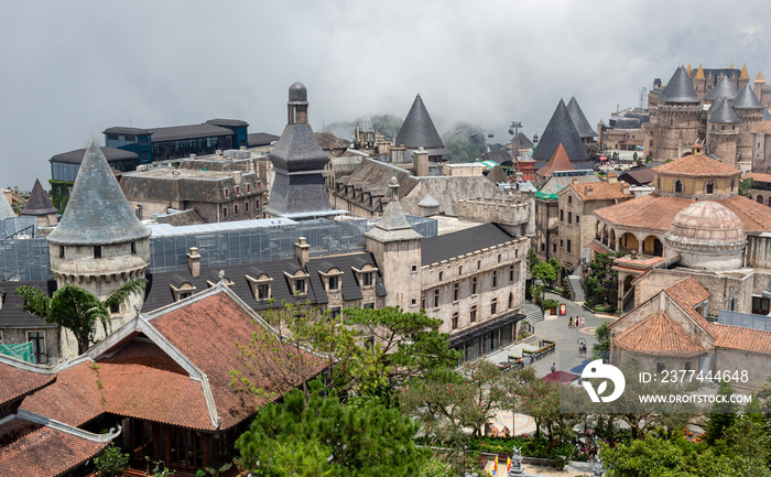 French-inspired village buildings at the Ba Na Hills Sunworld amusement park in DaNang Vietnam on a misty cloudy day