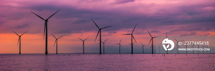 Windmill park with windmill turbines in the Netherlands aerial view of wind energy park during sunset