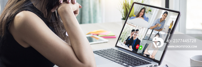 Work at home and social distancing concept, woman talking to her colleagues about plan in video conference in house, meeting and planning online as covid 19 or corona virus disease