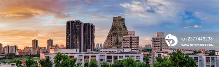 Panorama view of the Golden Hour sunset over the community parks and residential buildings in Bishan, Singapore