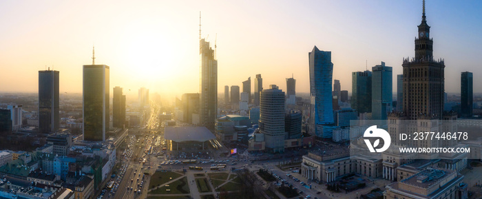 Panorama of Warsaw city center with modern architecture at sunset.