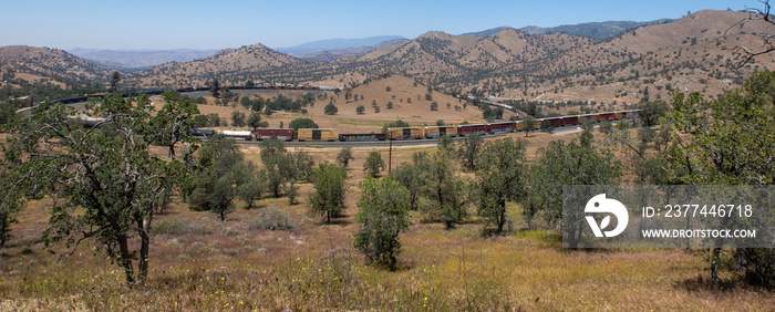 The Tehachapi Loop where Trains Cross over themelves to Climb a Steep Grade with 2 Trains Crossing together Time Lapse